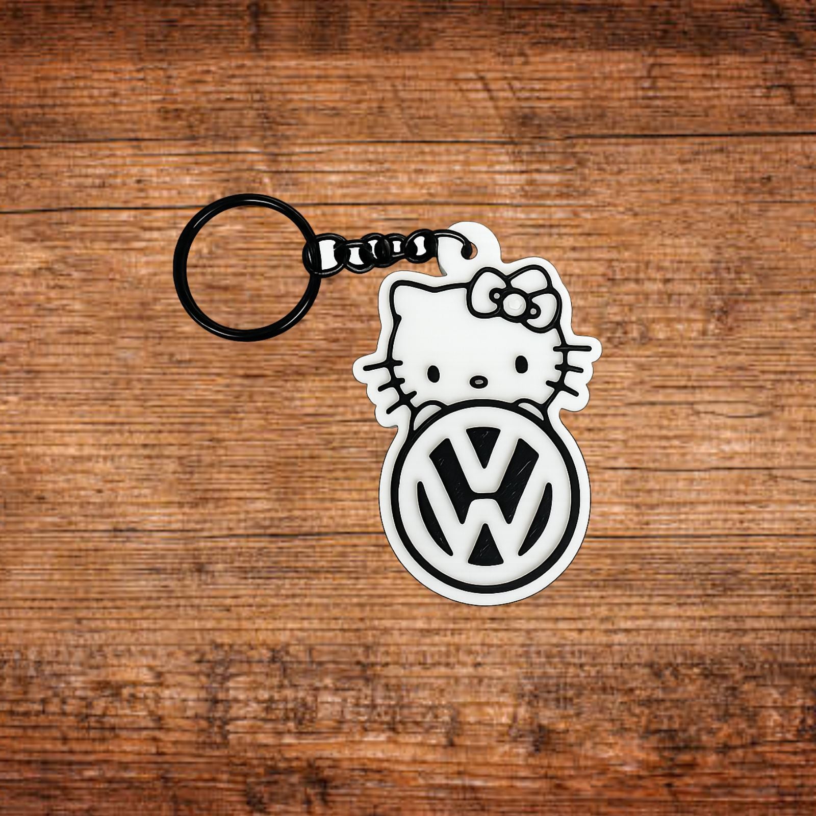 Schlüsselanhänger mit Hello Kitty und VW-Logo, weißes Motiv, schwarzer Ring