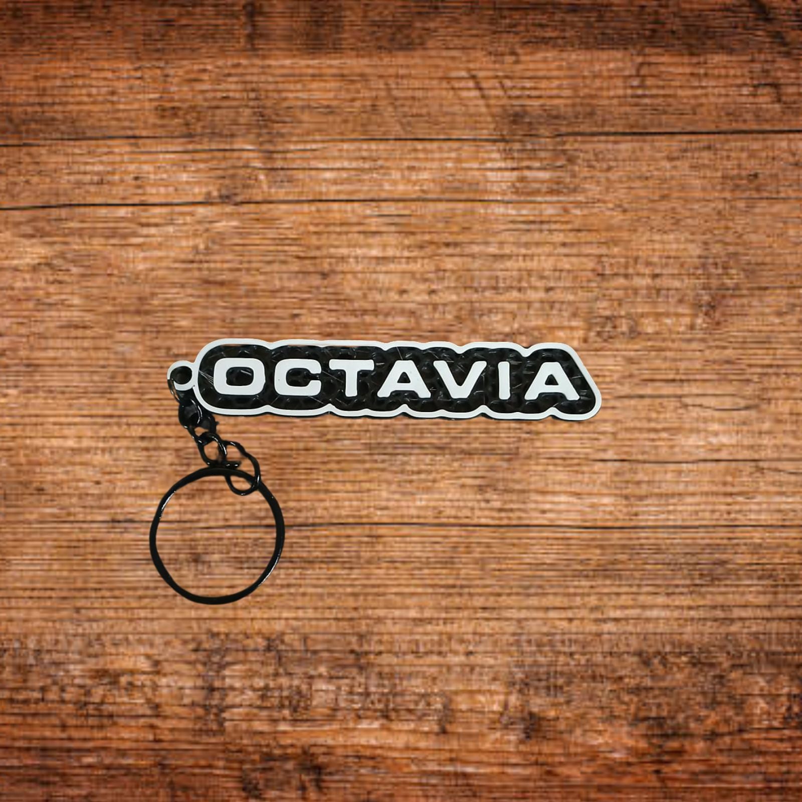Schlüsselanhänger mit Octavia-Schriftzug, schwarzer Ring
