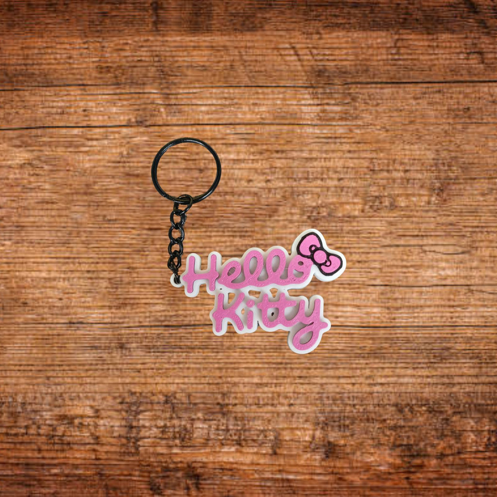 Hello Kitty Schlüsselanhänger mit Kette, rosa Schrift auf weißem Schriftzug