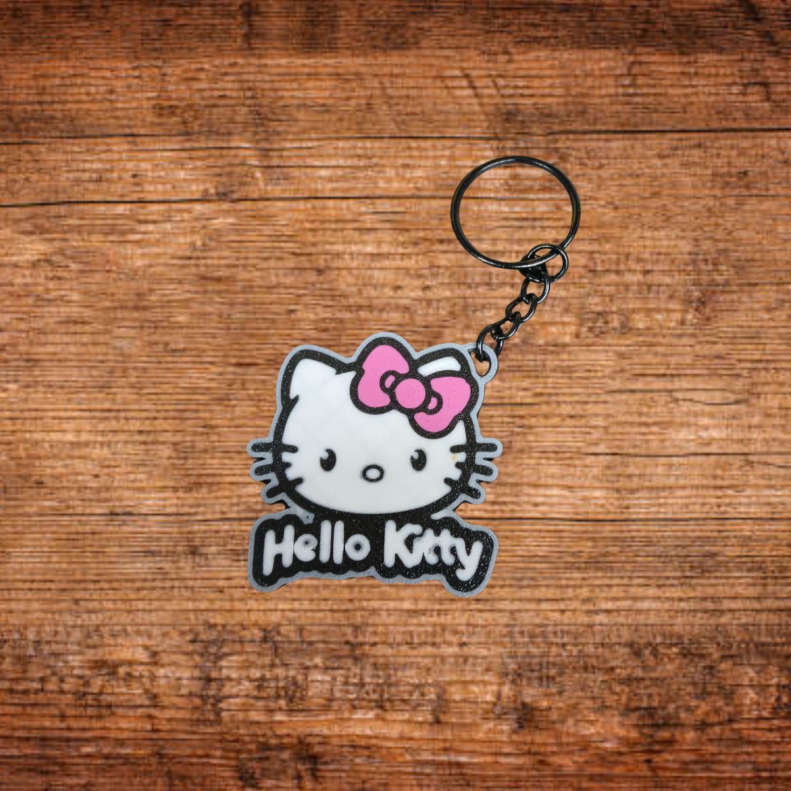 Hello-Kitty-Figuren-Schlüsselanhänger mit Kopf, rosa Schleife und Schriftzug Hello Kitty