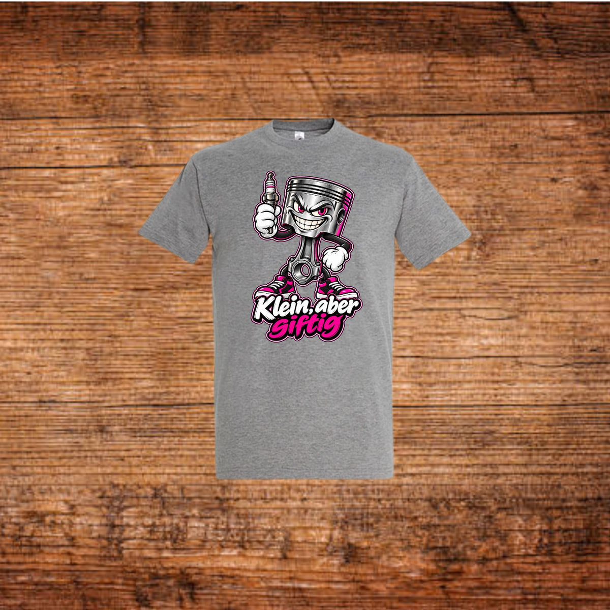 Graues T-Shirt mit Cartoon-Kolben und pinkem „Klein, aber giftig“-Aufdruck