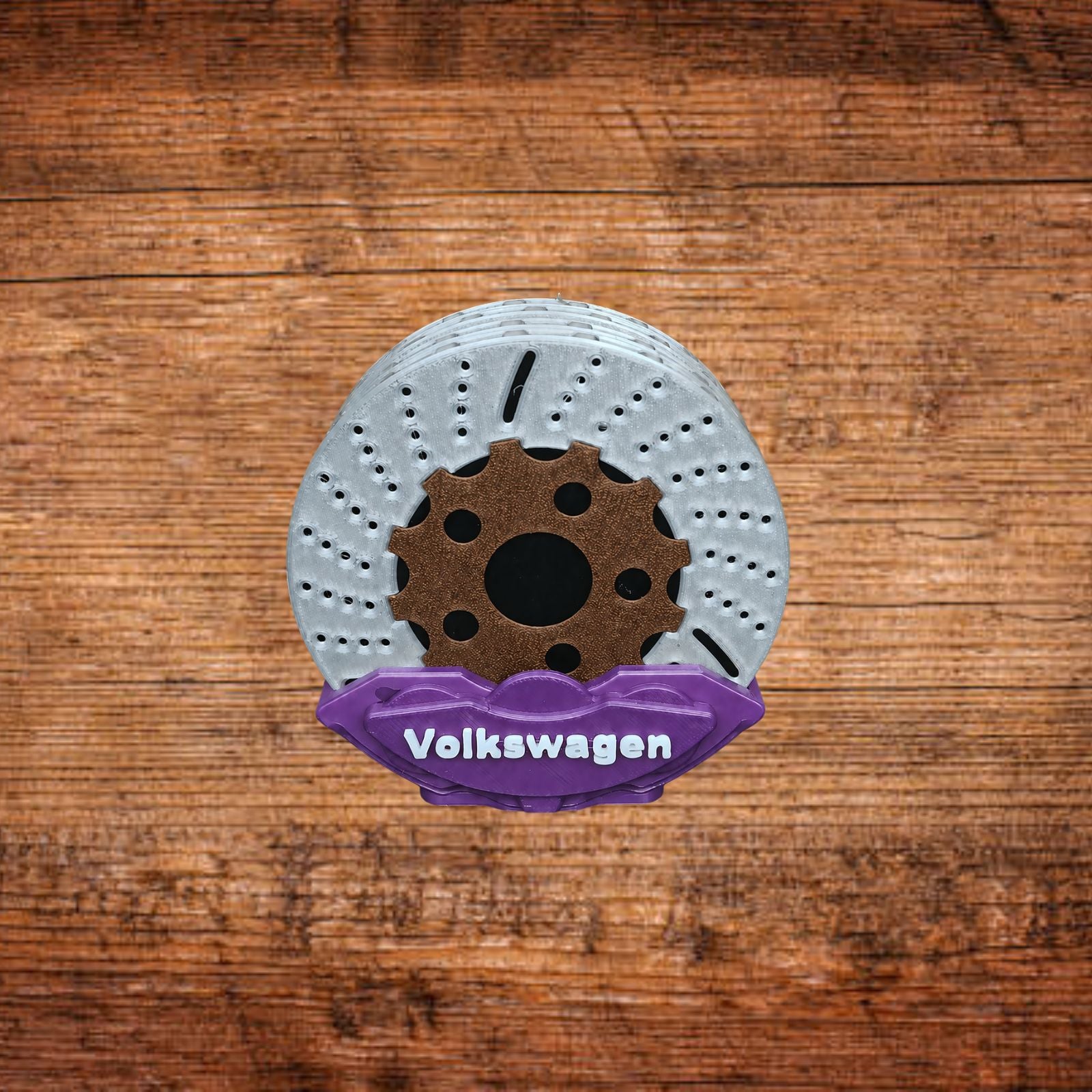 Bremsattel-Untersetzer mit weißer Bremsscheibe und violettem Volkswagen-Einsatz