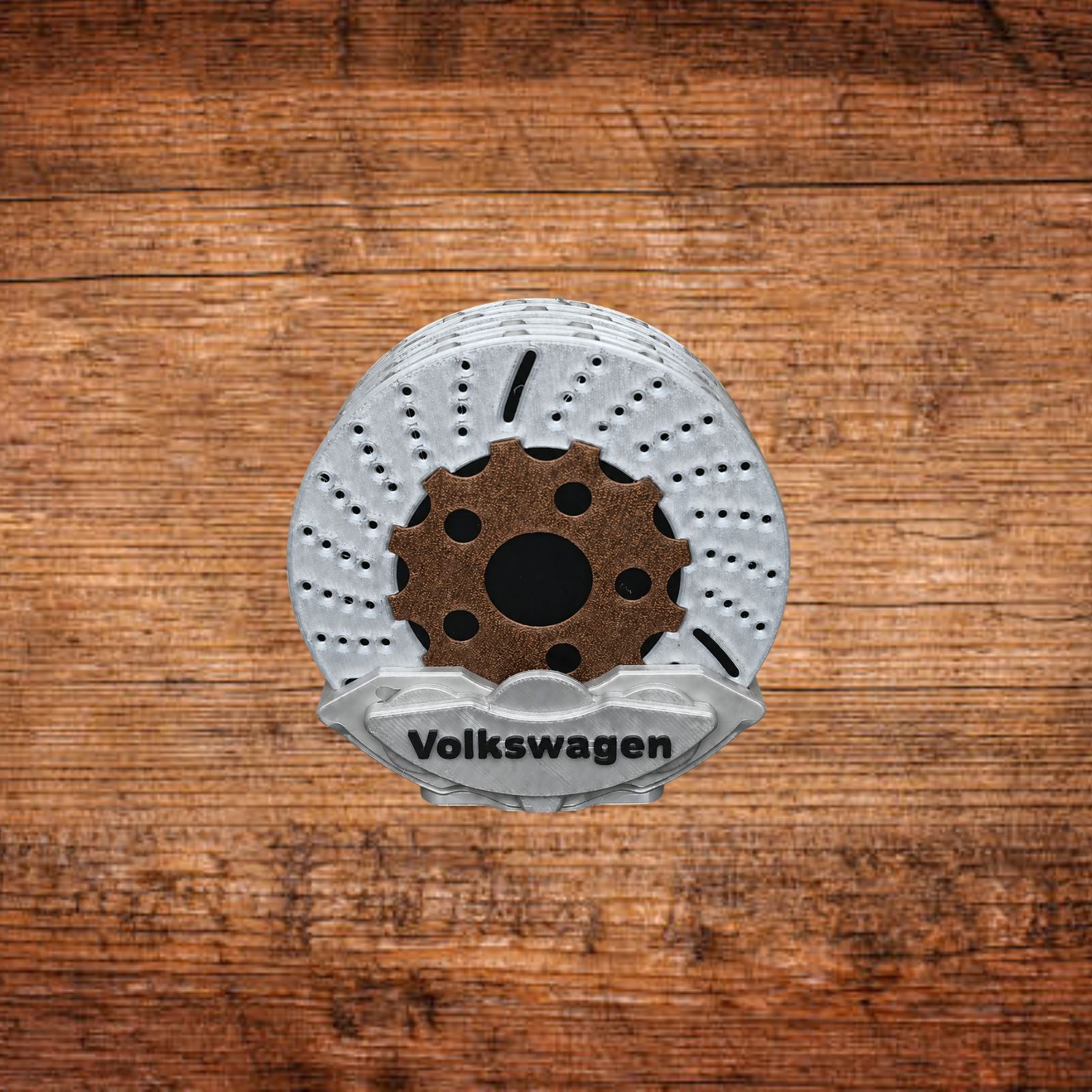 Bremsattel-Untersetzer mit weißer Bremsscheibe und grauem Volkswagen-Einsatz