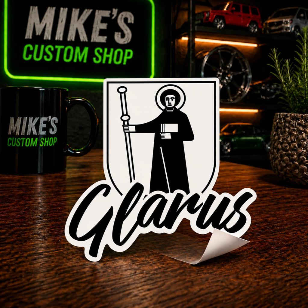 Glarus-Sticker mit Wappen und Schriftzug „Glarus“ mit weißem Rahmen und schwarzem Motiv