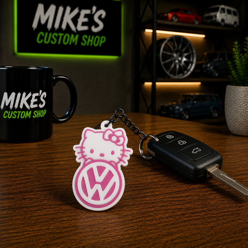 Schlüsselanhänger mit 3D Hello Kitty und VW-Emblem, pink mit Metallkette
